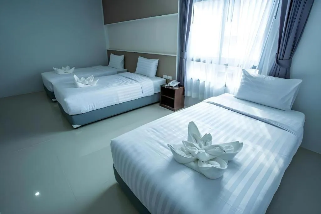 Bed in S-Tawan Hotel & Convention