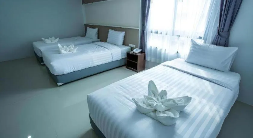Bed in S-Tawan Hotel & Convention