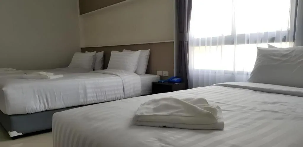 Bed in S-Tawan Hotel & Convention