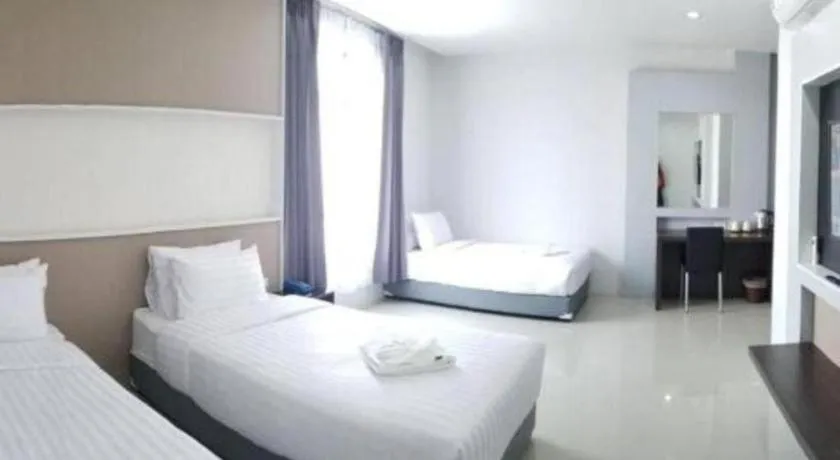 Bed in S-Tawan Hotel & Convention