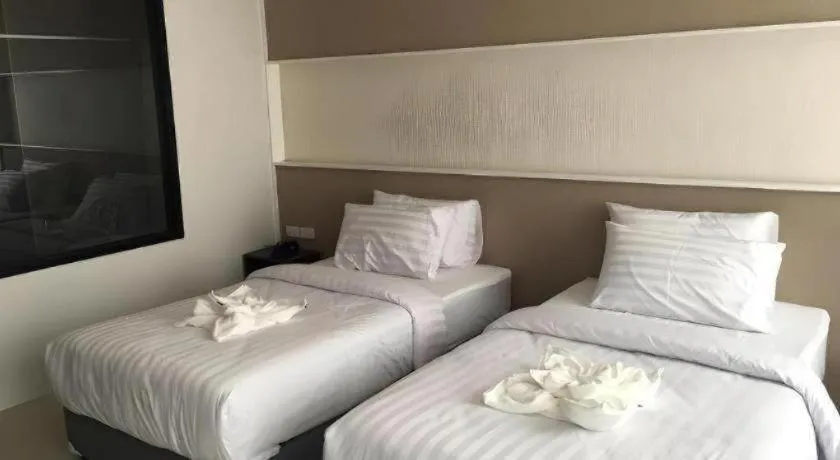 Bed in S-Tawan Hotel & Convention