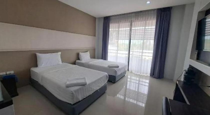 Bed in S-Tawan Hotel & Convention