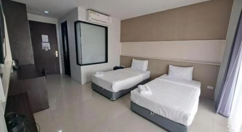 Bed in S-Tawan Hotel & Convention