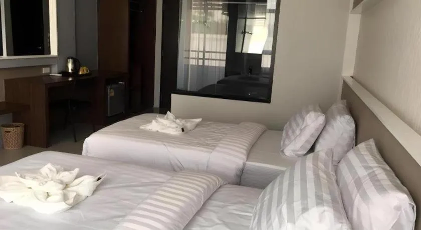 Bed in S-Tawan Hotel & Convention