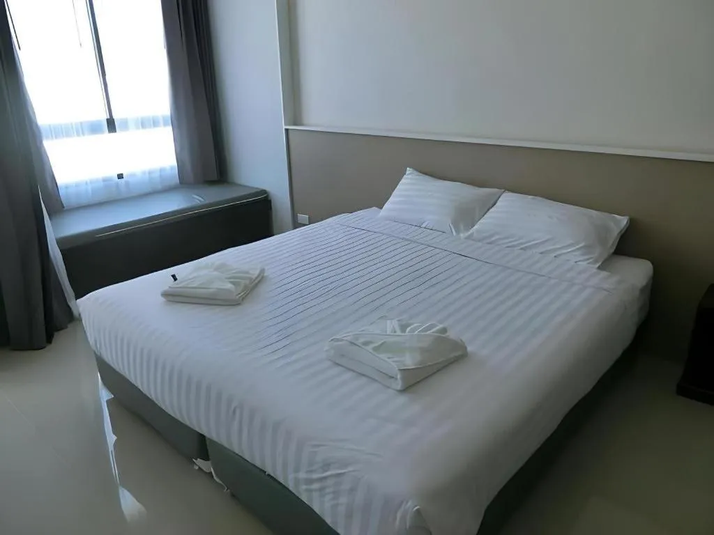 Bed in S-Tawan Hotel & Convention