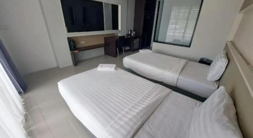 Bed in S-Tawan Hotel & Convention