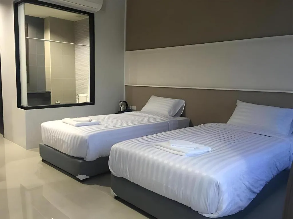 Bed in S-Tawan Hotel & Convention
