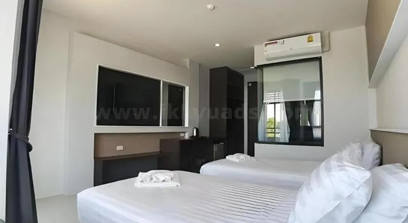 Bed in S-Tawan Hotel & Convention