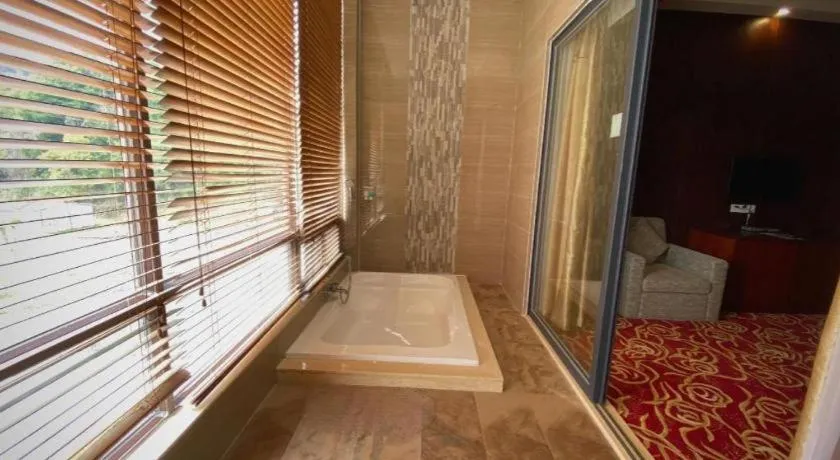 Bed in Longyan Capital International Hot Spring Resort