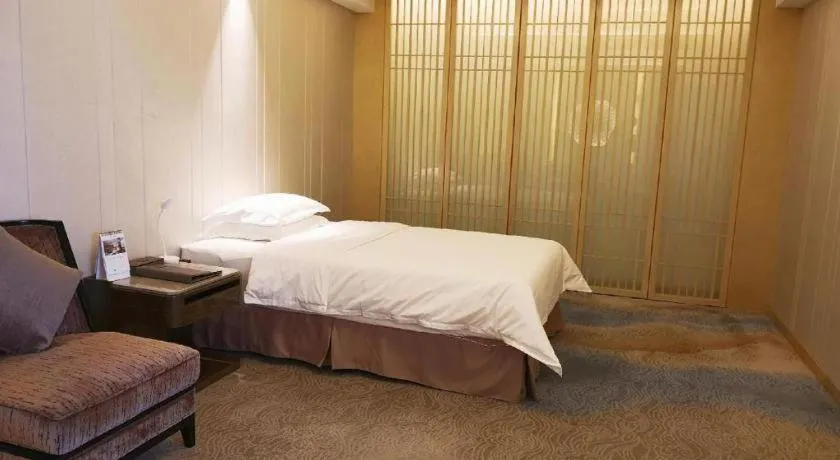 Bed in Licai Tianqi Hotel