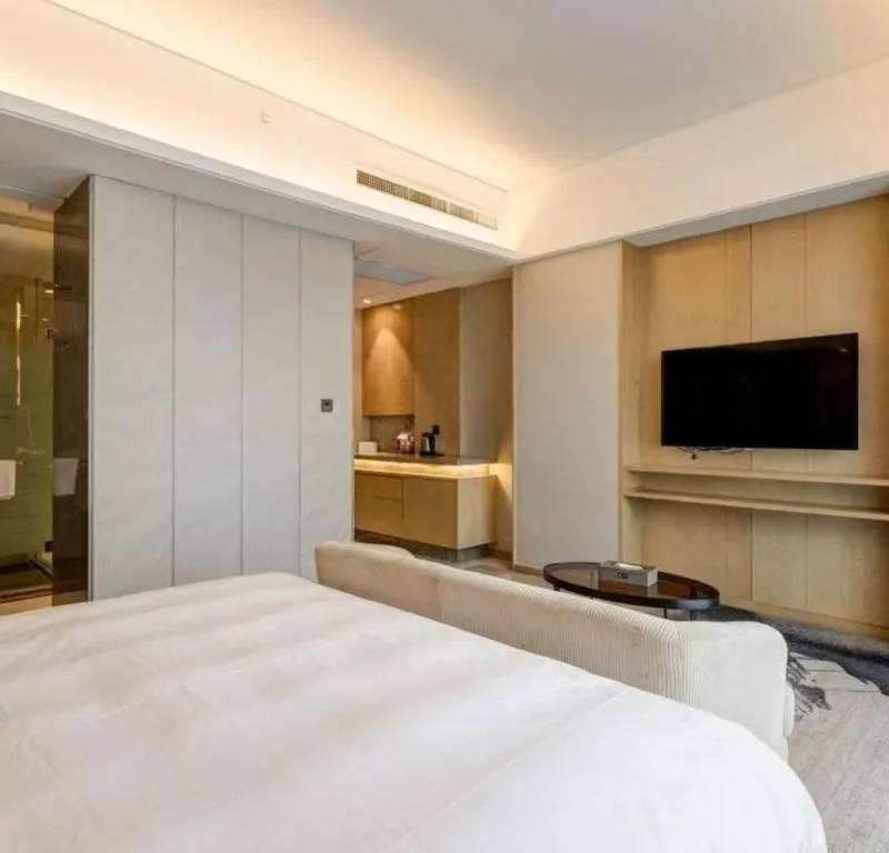 Bed in Licai Tianqi Hotel