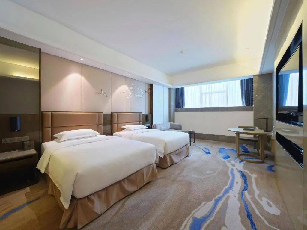 Bed in Licai Tianqi Hotel