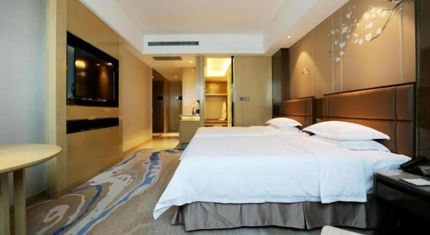 Bed in Licai Tianqi Hotel