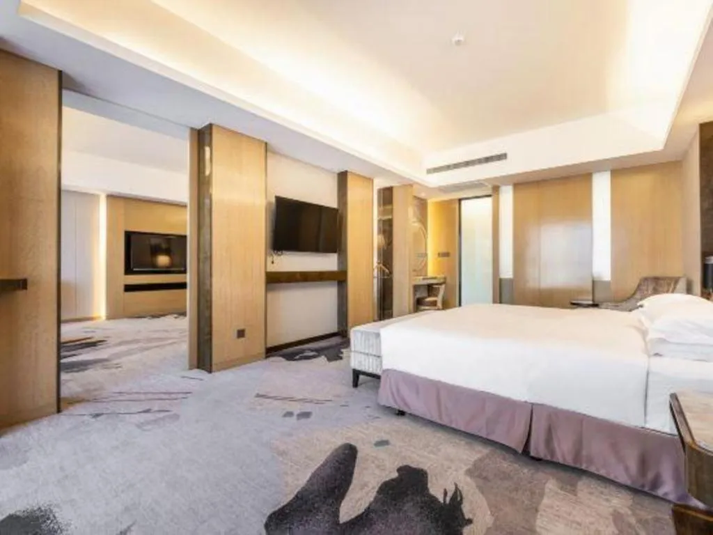 Bed in Licai Tianqi Hotel