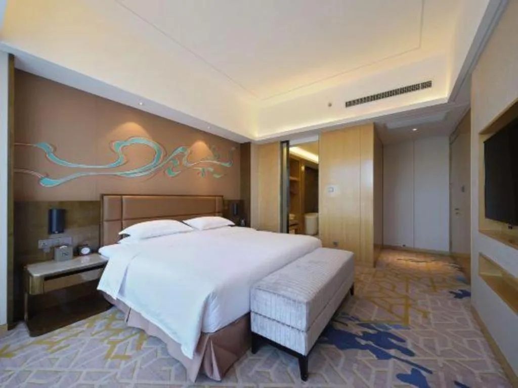 Bed in Licai Tianqi Hotel