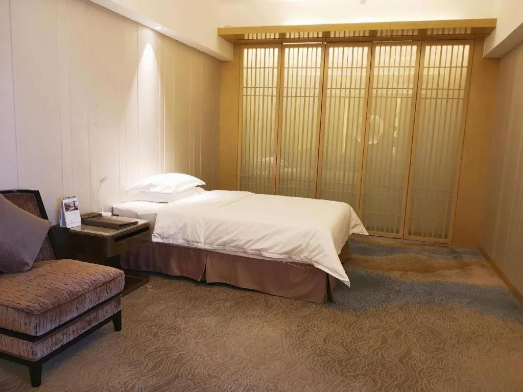 Bed in Licai Tianqi Hotel