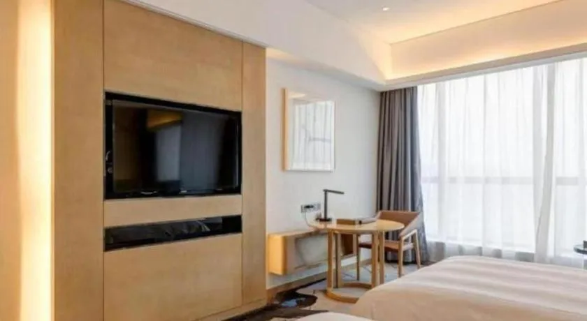 Bed in Licai Tianqi Hotel