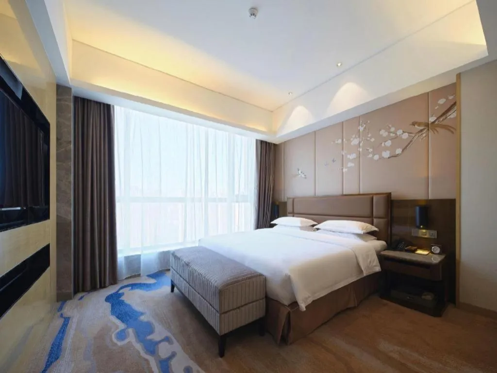 Bed in Licai Tianqi Hotel