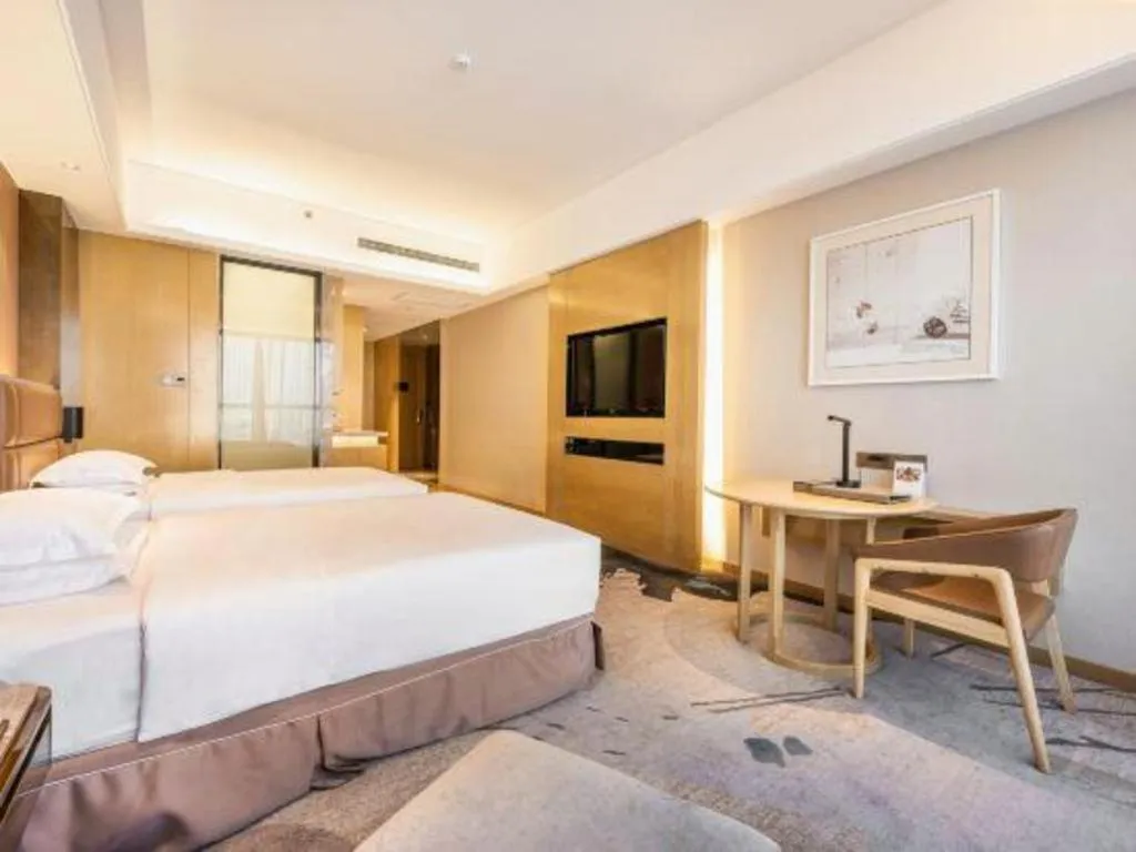 Bed in Licai Tianqi Hotel