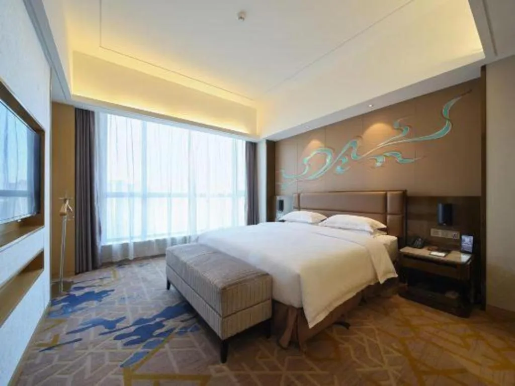 Bed in Licai Tianqi Hotel