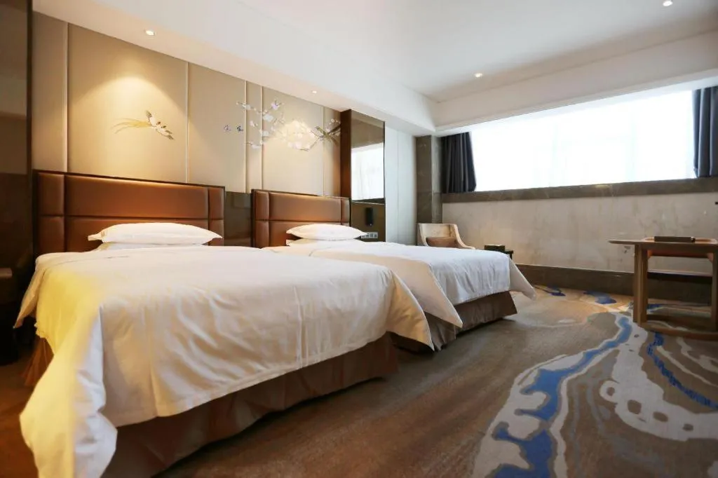 Bed in Licai Tianqi Hotel