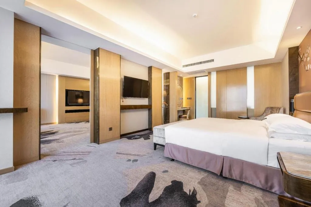 Bed in Licai Tianqi Hotel