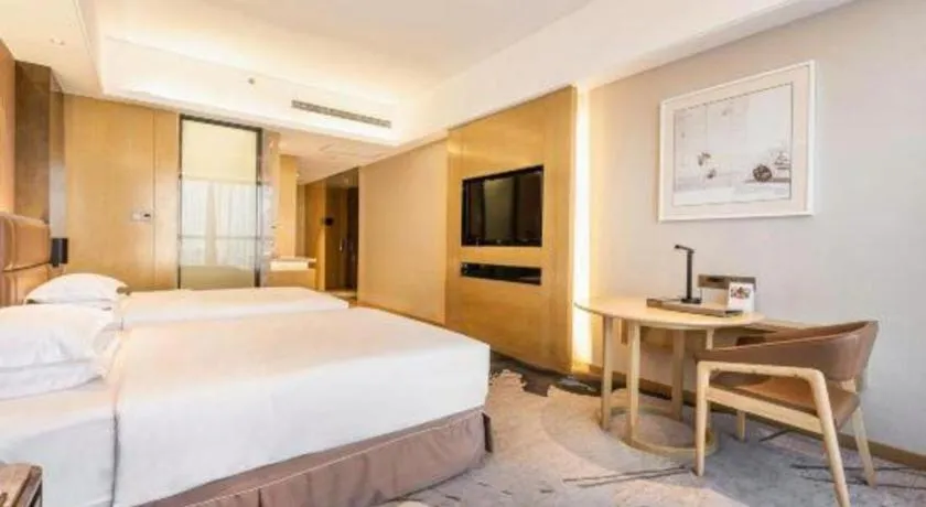 Bed in Licai Tianqi Hotel