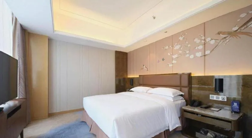 Bed in Licai Tianqi Hotel