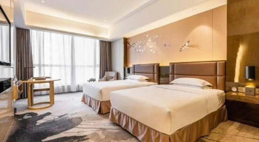 Bed in Licai Tianqi Hotel