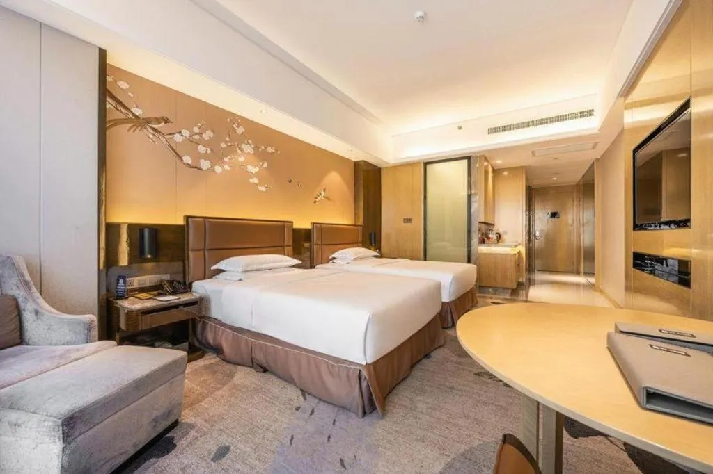 Bed in Licai Tianqi Hotel