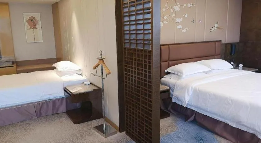 Bed in Licai Tianqi Hotel