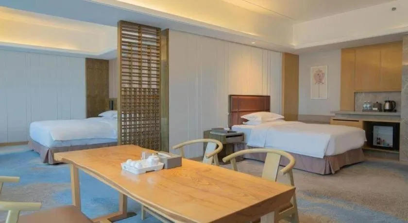 Bed in Licai Tianqi Hotel