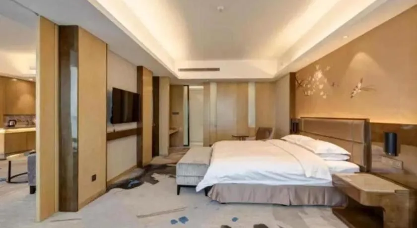 Bed in Licai Tianqi Hotel