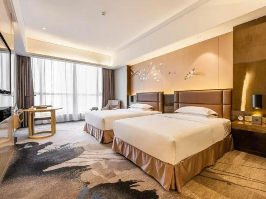 Bed in Licai Tianqi Hotel