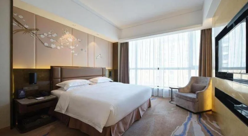 Bed in Licai Tianqi Hotel