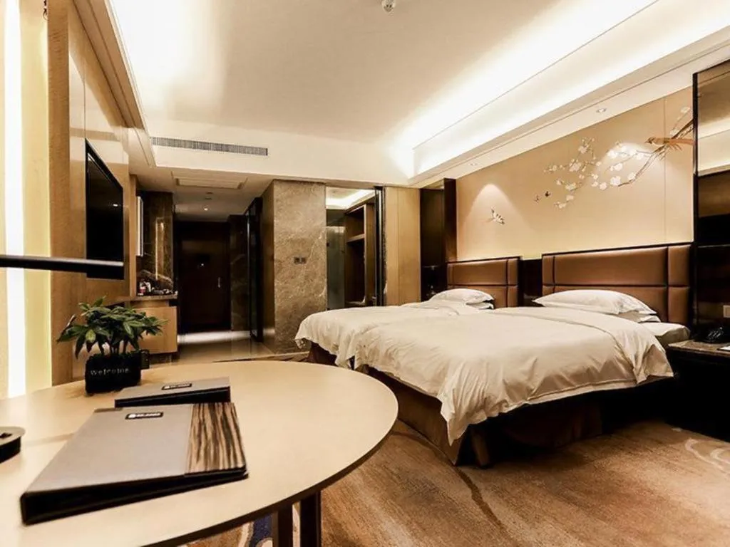 Bed in Licai Tianqi Hotel