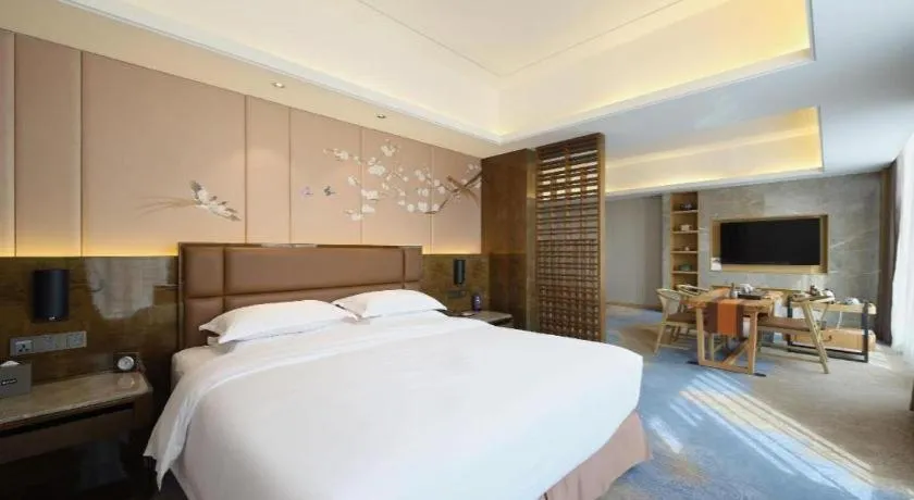 Bed in Licai Tianqi Hotel
