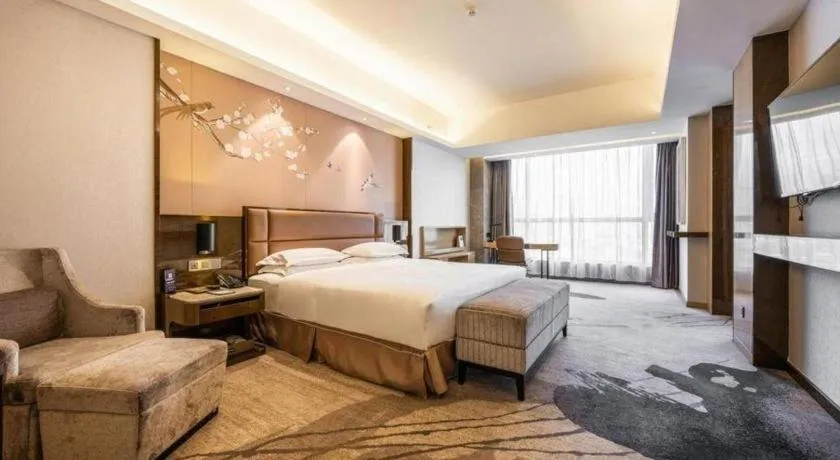 Bed in Licai Tianqi Hotel