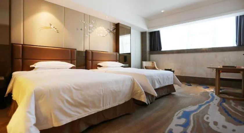 Bed in Licai Tianqi Hotel