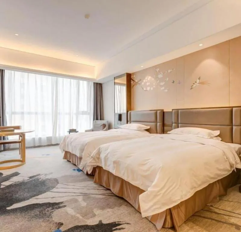 Bed in Licai Tianqi Hotel