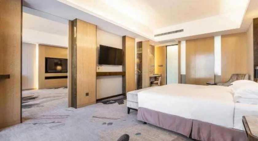 Bed in Licai Tianqi Hotel