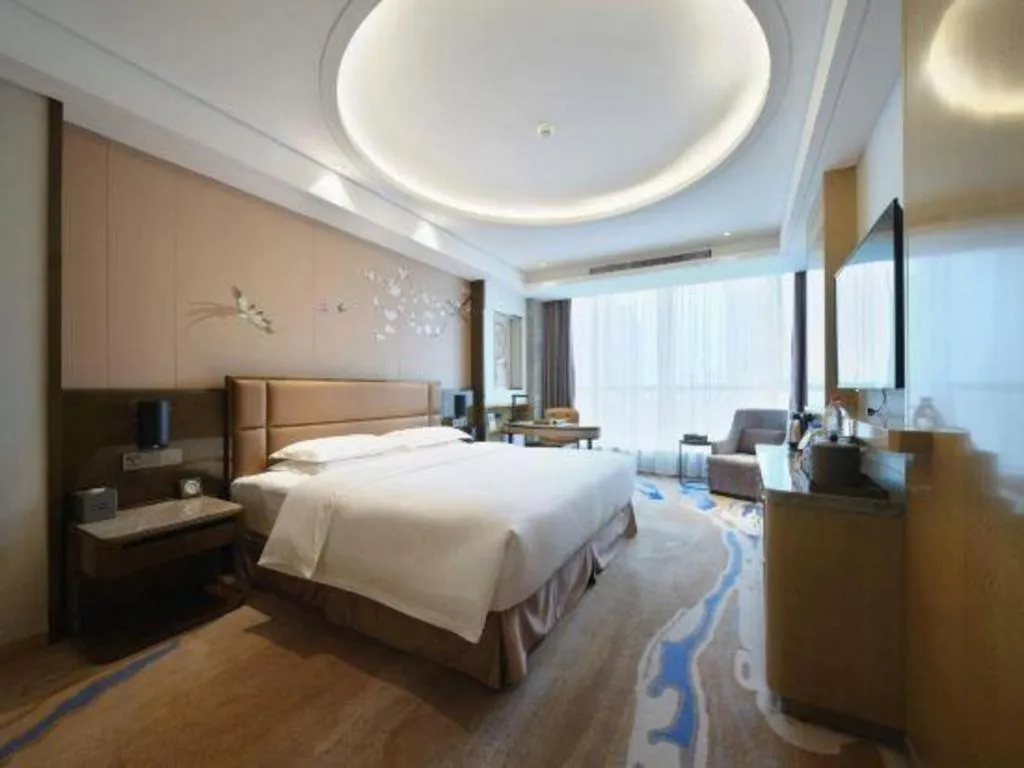 Bed in Licai Tianqi Hotel