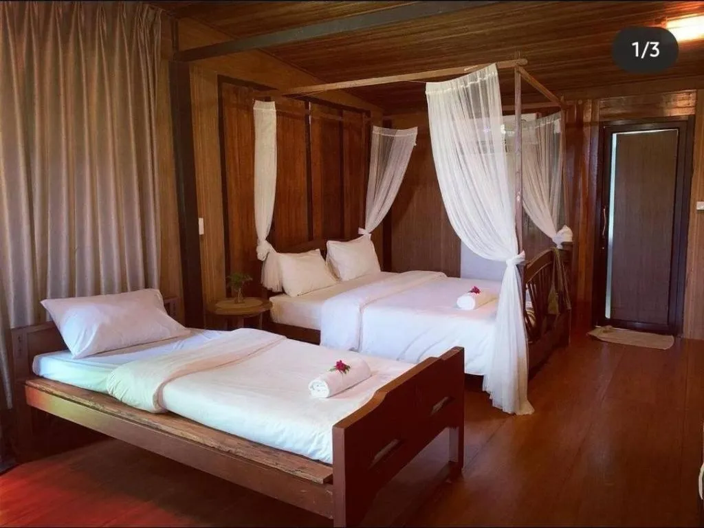 Bed in Le Bassin Erawan Resort
