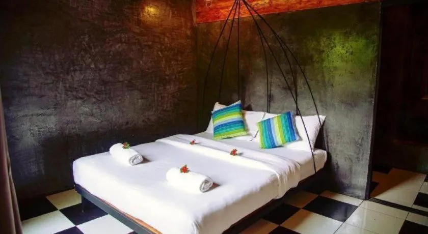 Bed in Le Bassin Erawan Resort