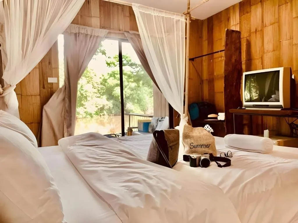 Bed in Le Bassin Erawan Resort