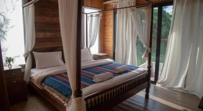 Bed in Le Bassin Erawan Resort