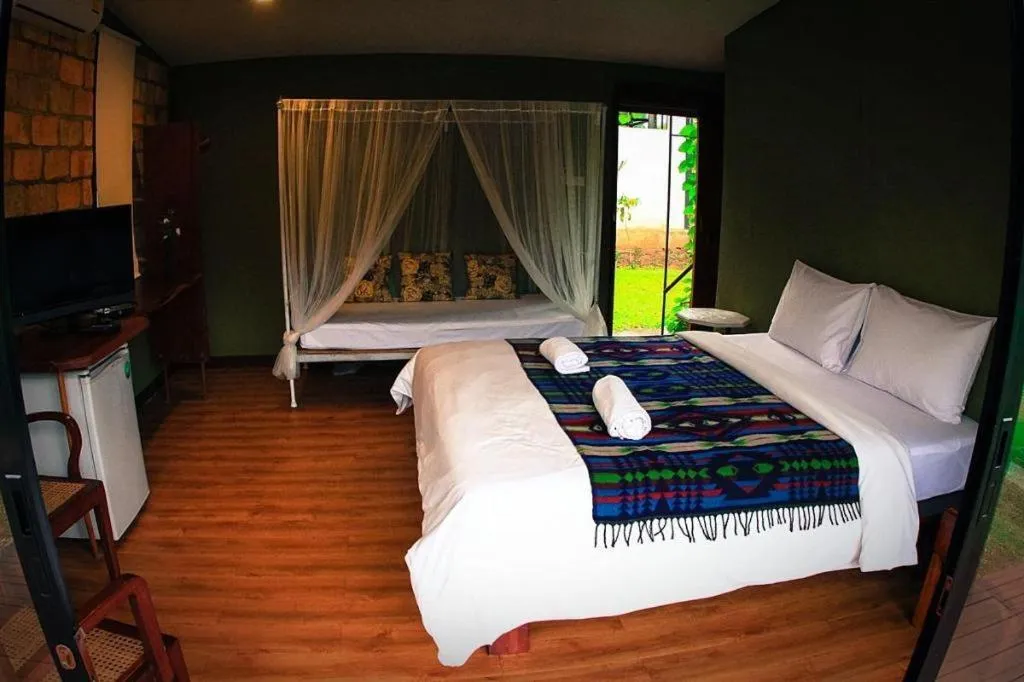 Bed in Le Bassin Erawan Resort