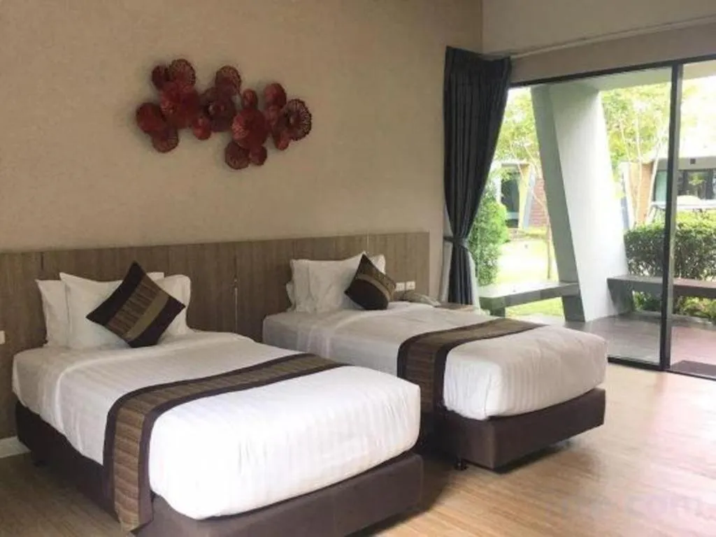 Bed in Chatnipa Beach Resort