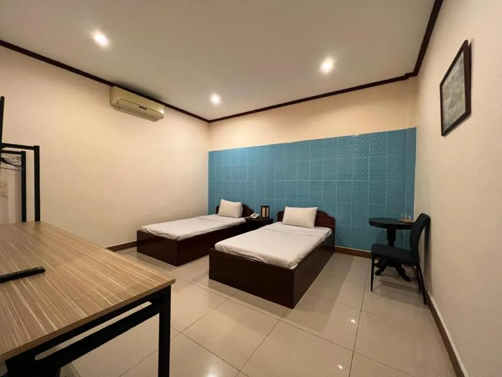 Bed in Souphaphone Hotel