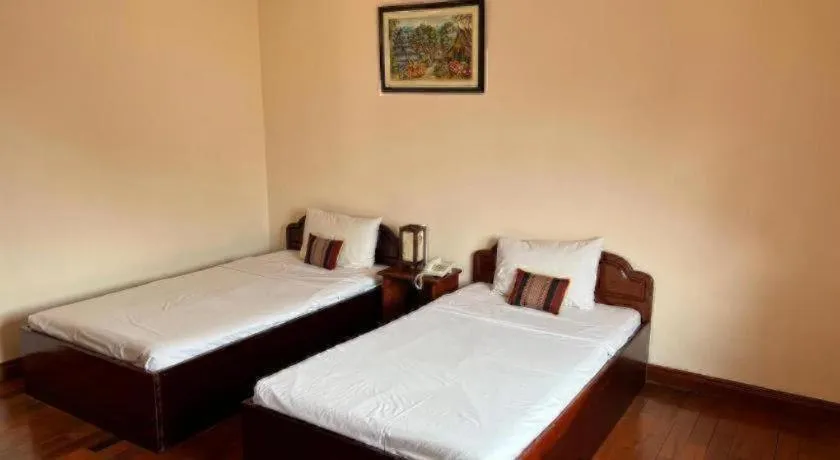 Bed in Souphaphone Hotel